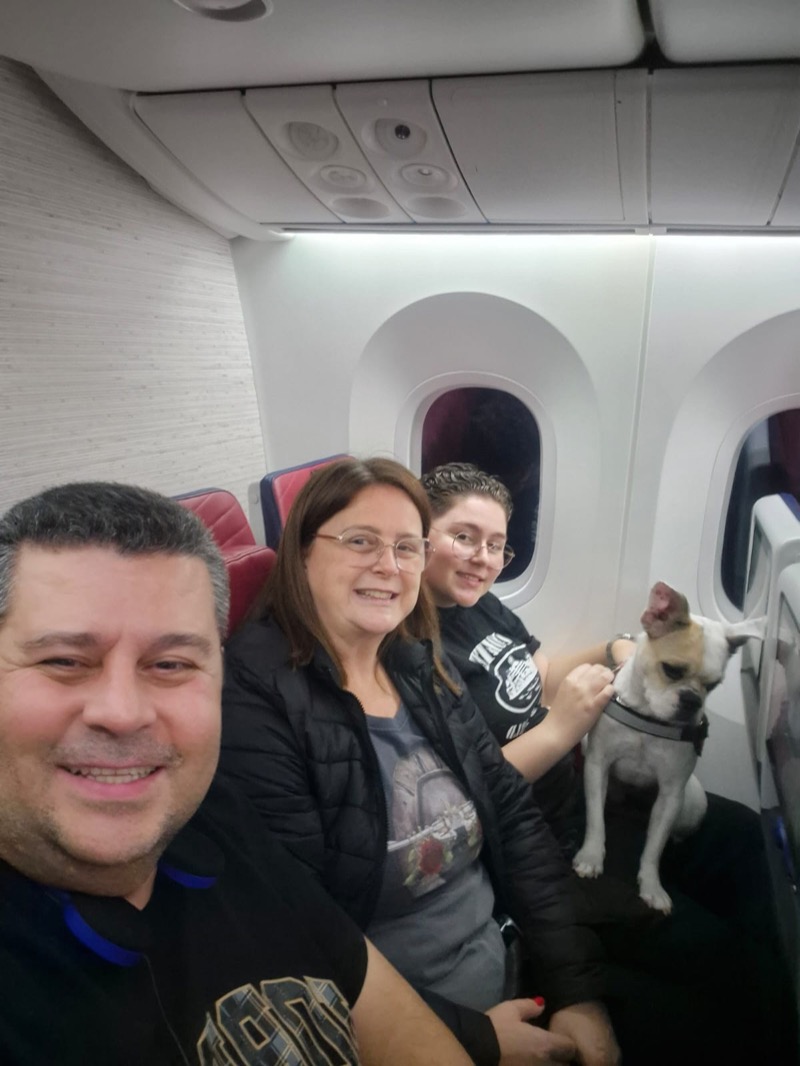 Family traveling on airplane with service dog